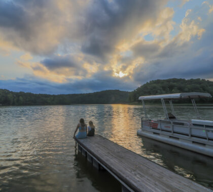 Two girls sitting on the dock of the bay 