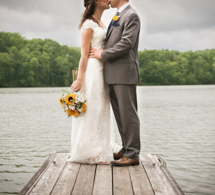 Bride and Groom kissing on the dock