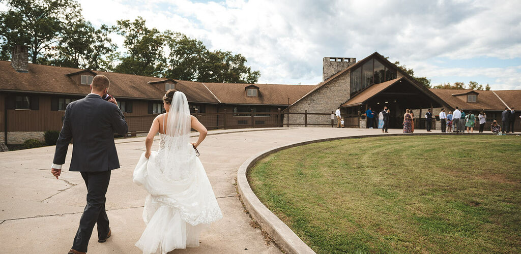 Bride and Groom walking up to ceremony 