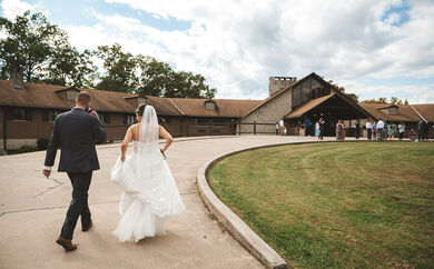 Bride and Groom walking up to ceremony 